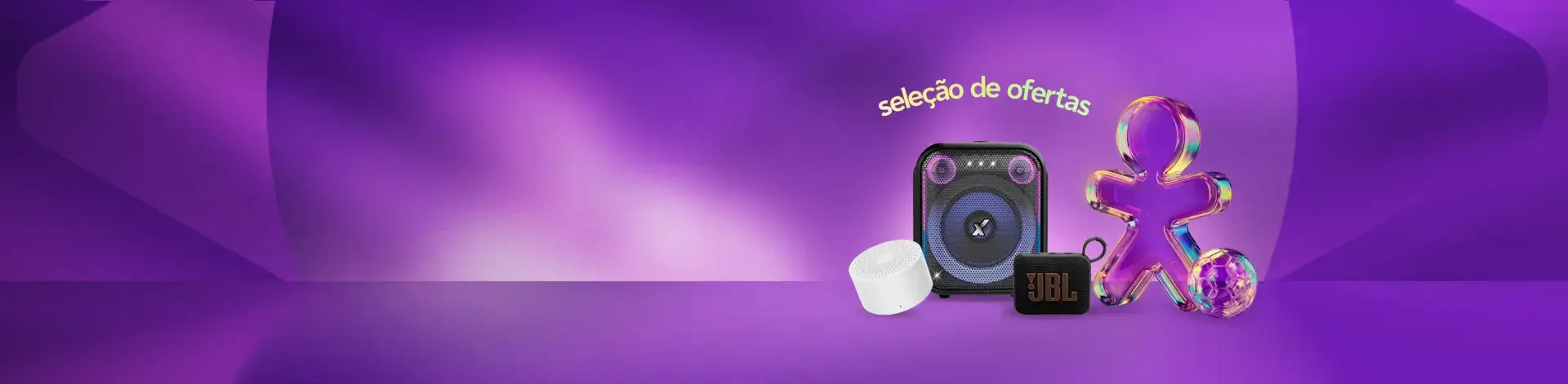 Imagem de uma caixa de som grande e uma pequena JBL  e uma outra branca redonda. 