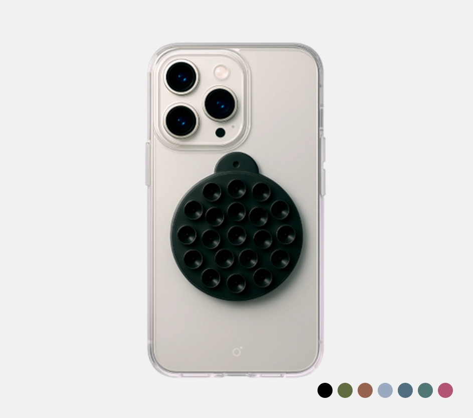 Imagem com fundo cinza e um modelo de iPhone com destaque para o produto Ventosa da marca Magsafe