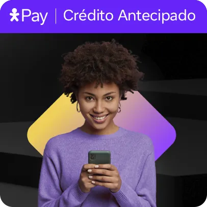 Mulher sorridente segurando um celular olhando para frente. Lê-se: Vivo Pay, Crédito Antecipado.