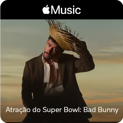 Imagem do cantor Bad Bunny com um terno desbotoado e um chapéu de palha
