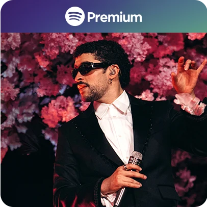 Imagem do cantor Bad Bunny de óculos escuros e ao fundo flores rosas.