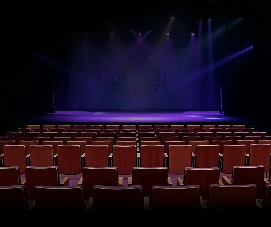 Ambiente do Teatro Vivo com fileiras de poltronas e palco em destaque.
